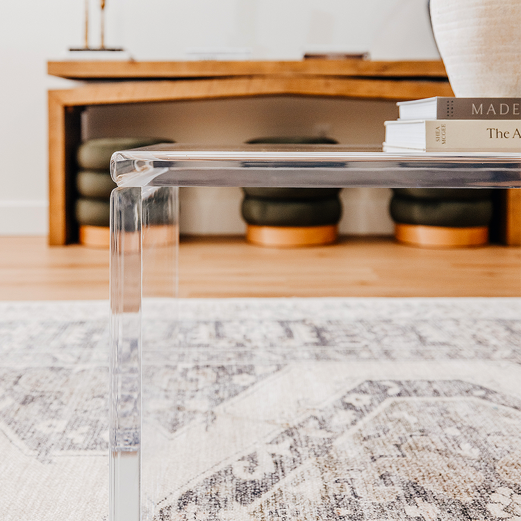 Closeup side view of the edges of an acrylic lucite coffee table.