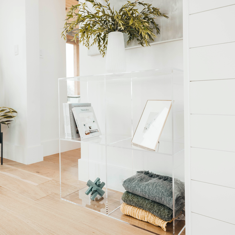 Clear acrylic 4 cube storage unit displaying artwork, plants, books, and decor. The unit features 2 rows of 2 cubes.