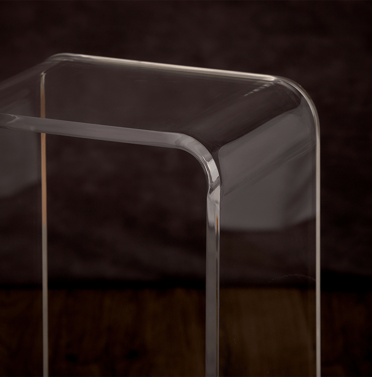 Closeup of the waterfall edge on a clear acrylic end table.