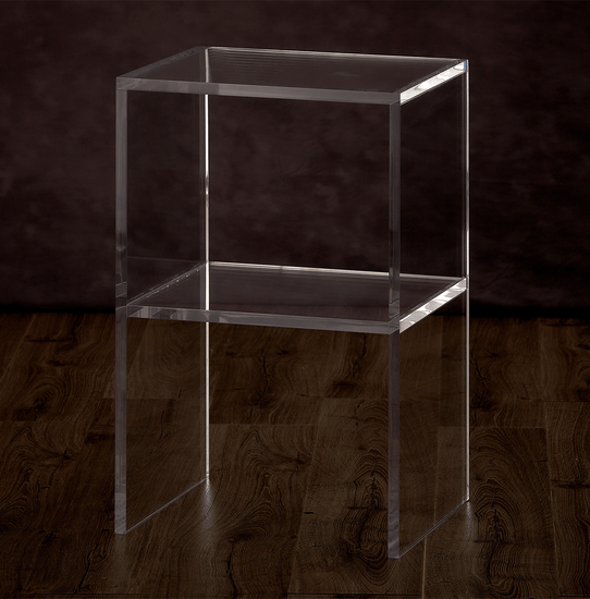 Catalog view of a clear acrylic slab nightstand with 1 interior shelf placed on a hardwood floor.
