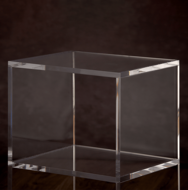 Catalog closeup of the edges on a clear acrylic slab nightstand.