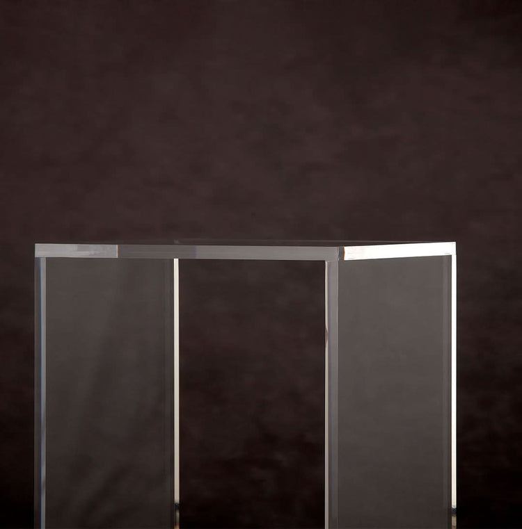 Catalog closeup of the edges on a vertical rectangular shaped acrylic side table.