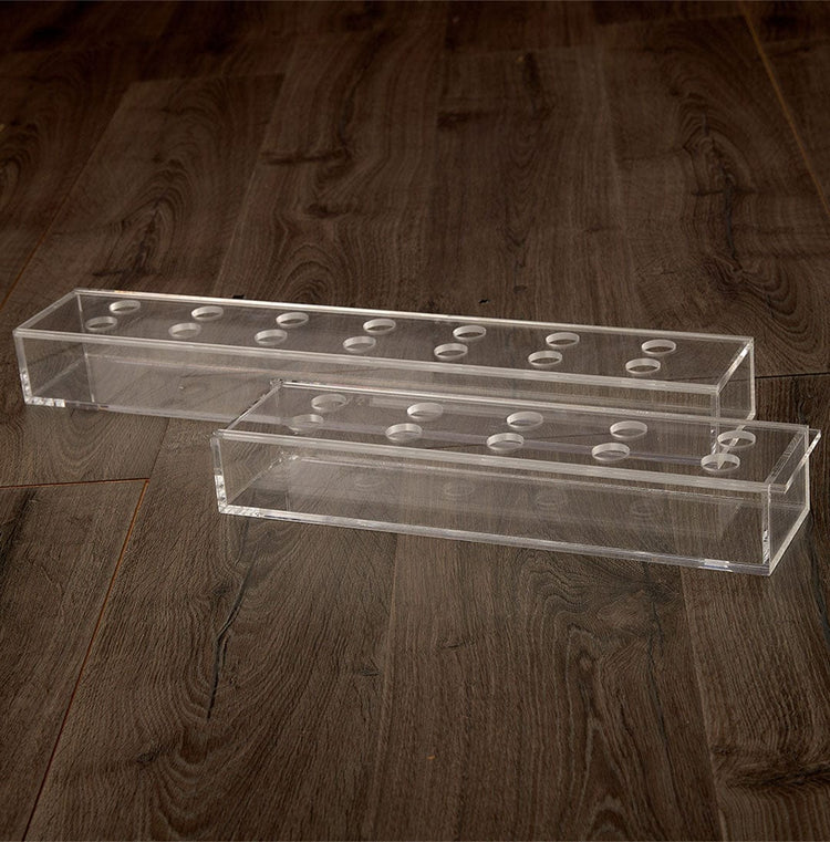 2 sizes of empty clear acrylic horizontal short stem floral centerpieces showing 1 size with 7 pairs of individual holes for flower placement and the 2nd size with 5 pairs of individiual holes.