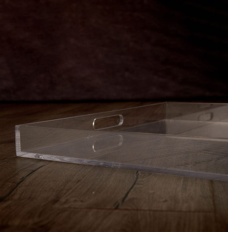 Catalog closeup of the edge of a clear acrylic serving tray.