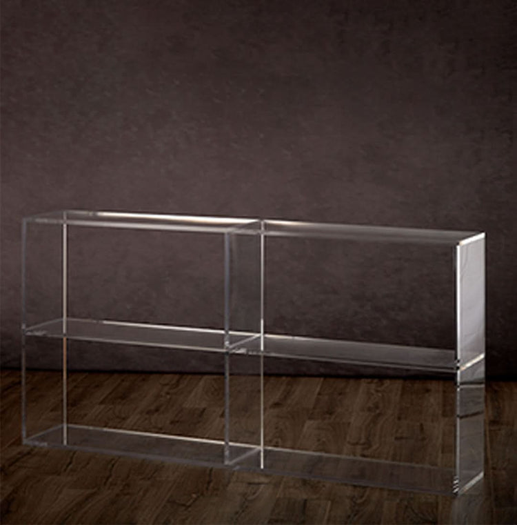 Clear acrylic 2 shelf horizontal bookcase on a hardwood floor.