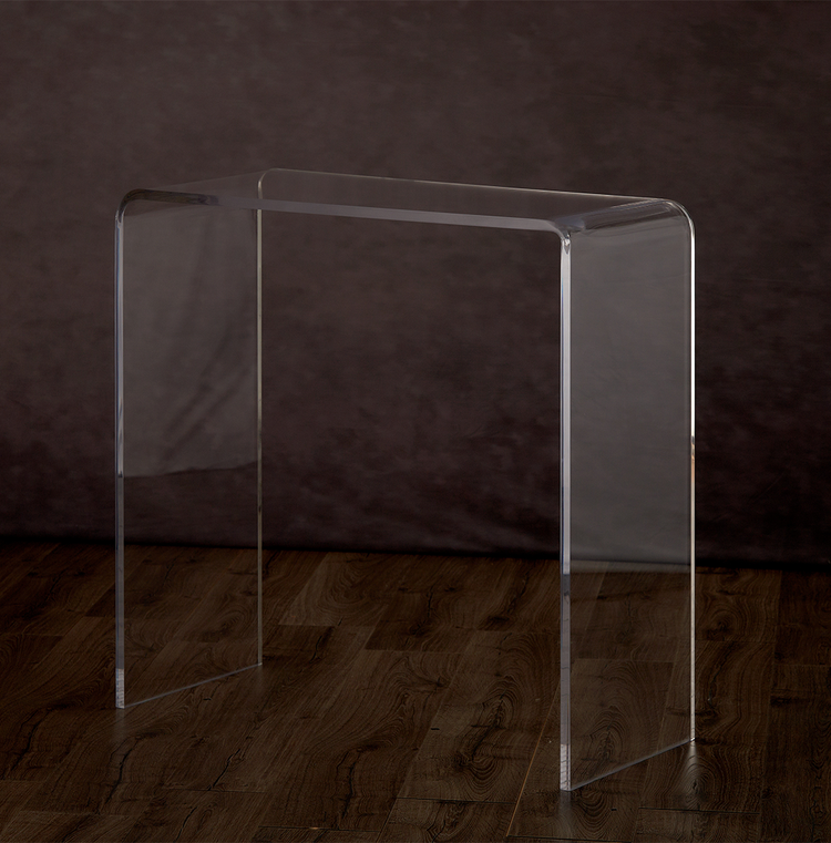 Catalog view of a clear acrylic waterfall edge entry or hallway table on a hardwood floor.