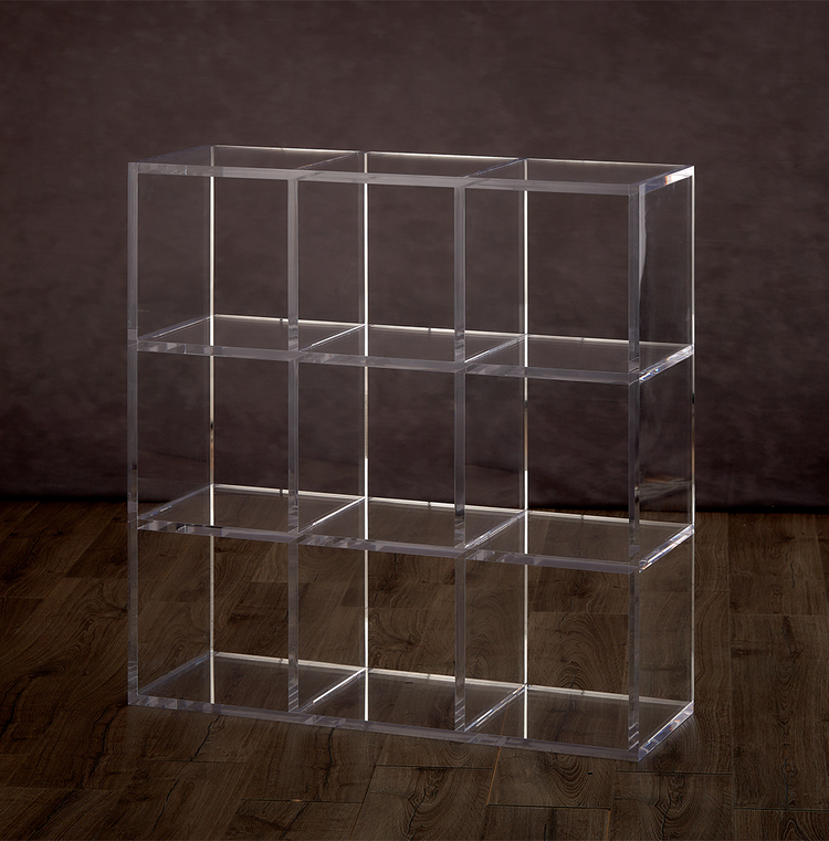 Catalog view of a clear acrylic 9 cube storage unit on a hardwood floor with 3 rows of 3 cubes.