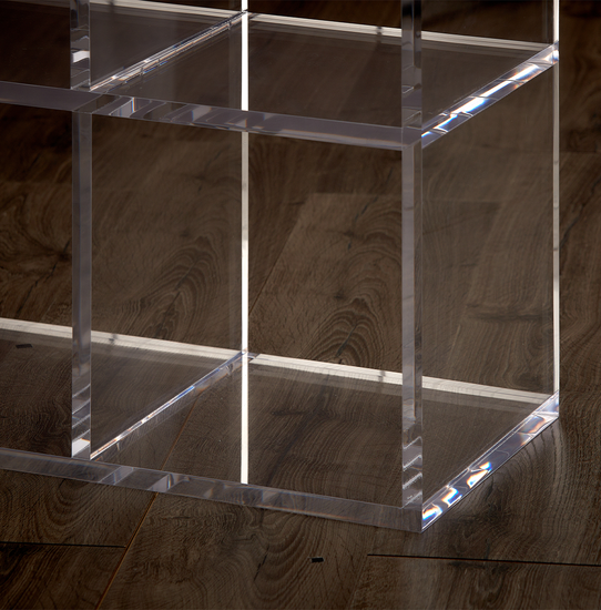 Catalog closeup of the edges on a clear acrylic cube storage unit.