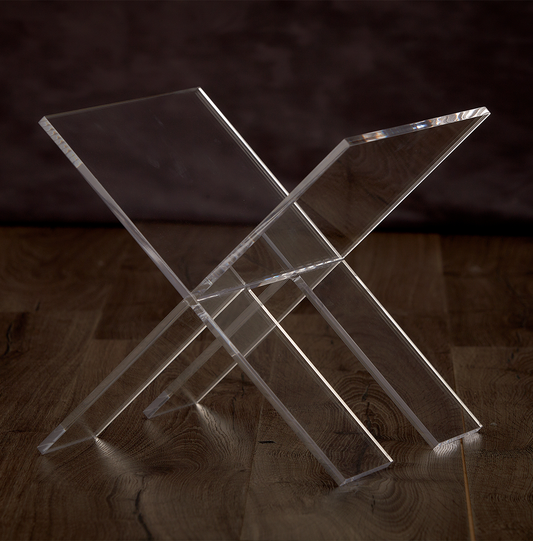 Catalog view of a clear acrylic X design magazine rack.