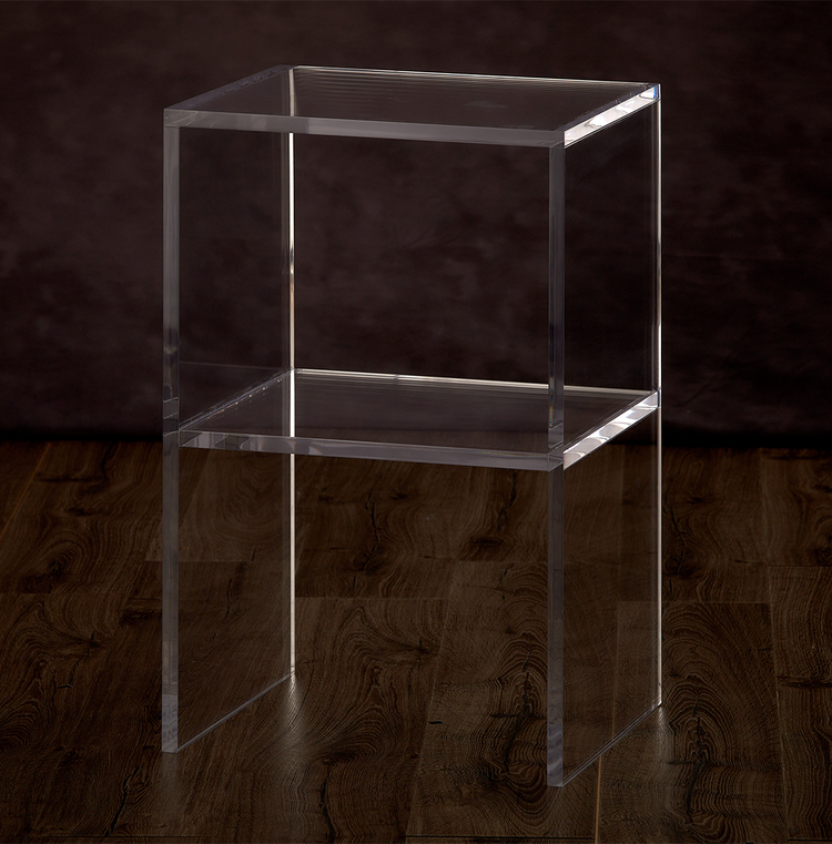 Catalog view of a clear acrylic slab nightstand with 1 interior shelf placed on a hardwood floor.