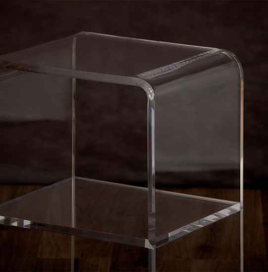 Catalog closeup of the waterfall edge on a clear acrylic nightstand.