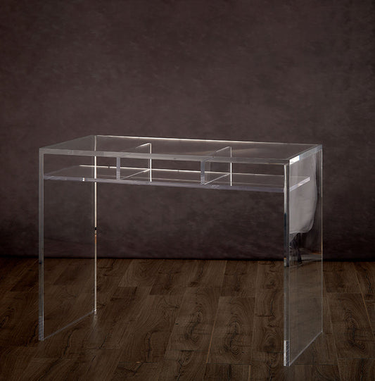 Clear acrylic slab style desk with 3 interior shelves on a hardwood floor.