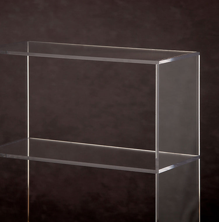 Catalog closeup of a clear acrylic 3 shelf bookcase.